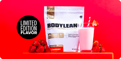 BodyLean Strawberry Gusset Bag surrounded by a mixed BodyLean strawberry shake and strawberries on a red platform 