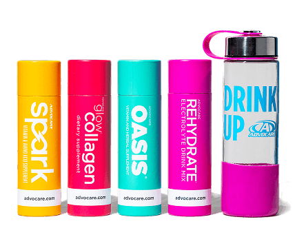 AdvoCare Spark, Glow Collagen, Oasis and Rehydrate Sample Packs standing next to a Glass AdvoCare Water Bottle.
