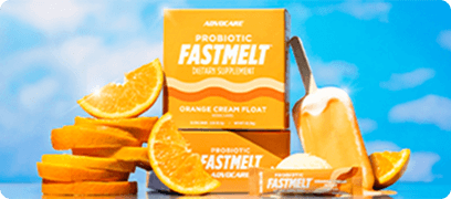 FastMelt Orange Cream Float boxes surrounded by orange slices and cream float popsicles on a blue sky background.