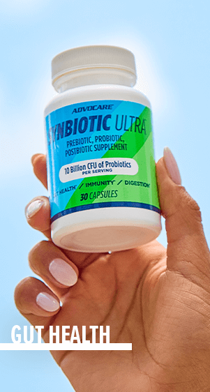 Gut Health - a manicured hand holding up a bottle of Synbiotic Ultra