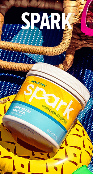Spark Orange Cream Float. A hand holding the lid of Spark canister.