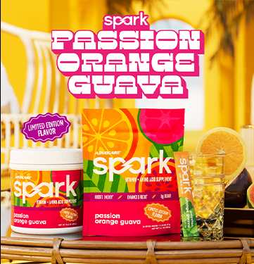 Limited Edition Flavor Spark Passion Orange Guava stick pack and canister in a summery scene on a beach deck.