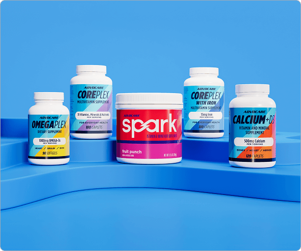 AdvoCare Dpsrk, OmegaPlex, CorePlex, CorePlex with Iron, and Calcium + D3 sitting on a blue platform.